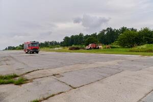 In this captivating scene, a state-of-the-art firetruck, equipped with advanced rescue technology, stands ready with its skilled firefighting team, prepared to intervene and respond rapidly to photo