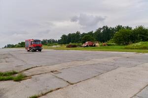 In this captivating scene, a state-of-the-art firetruck, equipped with advanced rescue technology, stands ready with its skilled firefighting team, prepared to intervene and respond rapidly to photo