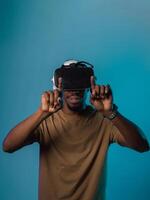 Immersed in a digital realm, an African American man navigates the virtual landscape with a VR goggles, using tactile gestures to interact with virtual objects, showcasing a harmonious blend of photo