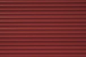 Texture of red old external blinds on windows. Painted wooden surface. Creative background photo