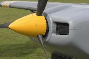 Fragment of the front part of a light aircraft with a propeller. Close-up, screws, texture, surface photo