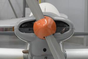 Part of a propeller on light aircraft . Close-up, screws, texture, color surface photo