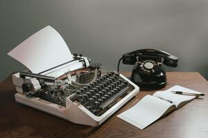 Checkbook with a blank page. Retro concept with old phone, ink pen and typewriter. in color photo