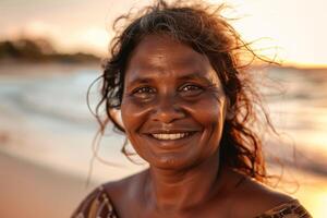 Aboriginal Australian Woman Smiling At Sunset photo