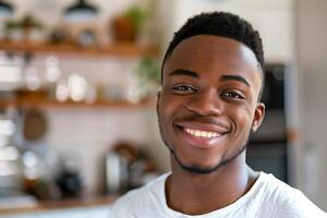 Young Man Smiling In Cozy Kitchen photo