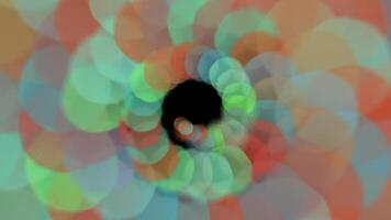 a colorful circular object with a black hole in the center video