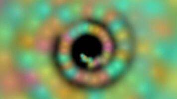 a colorful circular object with a black hole in the center video
