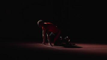 Runner On Start, Full-Length Shot With Athletic Man Standing in Low Start Position On Running Track video