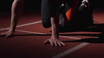 Start Of Runner Race, Closeup View Of Sportsman Hands On Floor And Legs In Starting Blocks, Details video