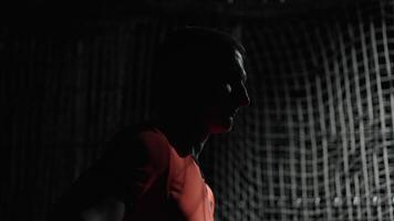 Goalkeeper Standing Against Net Of Gate In Dark Stadium, Profile Of Tired Sportsman After Workout video