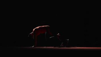 Silhouette Of Professional Runner On Start In Darkness, Sprinter Leaning On Starting Blocks video