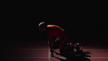 Starting From Low Start Position On Running Track In Stadium, Professional Runner Training video