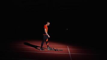 Tired Runner Training Alone On Run Track, Slow Motion Shot, Athlete Standing In Low Start Position video