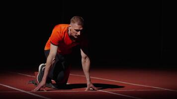 Active Sportsman On Start Of Run Track In Stadium, Athletic Man Starting And Running, Slow Motion video