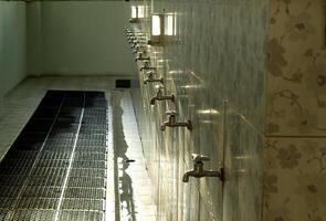 ablution faucet used for purification in the mosque. photo