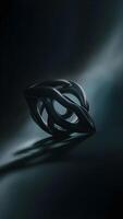 A black ring with a bold design, perfect for adding a touch of elegance to any outfit. photo