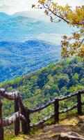 The stunning view in Forest Park from a tourist's standpoint as they go down a hill with background of blue sky, Rainforest, Thailand. Bird's eye view. Aerial view. photo