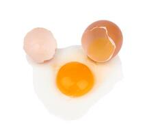 Broken eggs on white photo