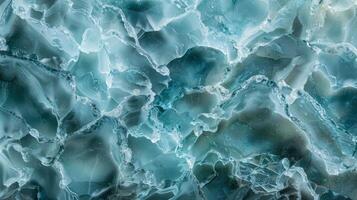 Textured Sea Glass Surface with Intricate Fractures and Varied Hues of Blue and Green for Design and Print photo