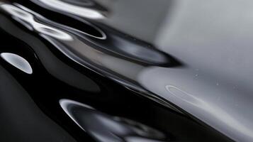 Glossy Lacquered Metal Surface, Reflective Black and White Abstract Textures, Suitable for Modern Art Prints and Background Design photo