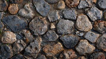 A close up view of a stone wall constructed with large rocks photo