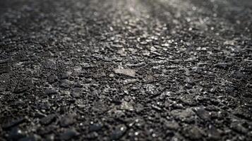 Rough Textured Asphalt Road Surface with Glimmering Pebbles, Ideal for Industrial Design and Urban Background Concepts photo