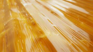 Smooth Lacquered Bamboo Surface with Golden Honey Texture, Detailed and Glossy for Design and Background Use photo