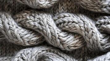 Detailed Close-Up of Textured Grey Knitted Wool Fabric for Textiles and Design Projects photo