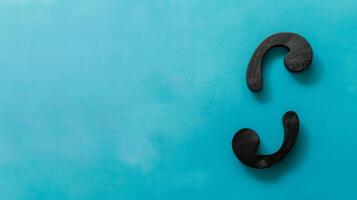 Black Hooks Mounted on Blue Wall. AI-generated photo