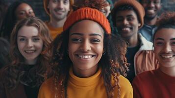 a diverse group of young adults smiling looking photo