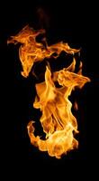 Fire and burning flame of explosive fireball isolated on dark background for abstract graphic design photo