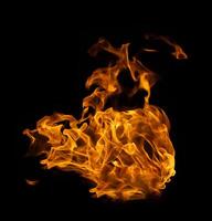 Fire and burning flame of explosive fireball isolated on dark background for abstract graphic design concept photo