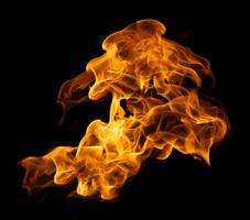 Fire and burning flame of explosive fireball isolated on dark background for abstract graphic design photo