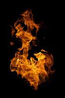 Fire and burning flame of explosive fireball isolated on dark background for abstract graphic design concept photo