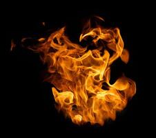 Fire and burning flame of explosive fireball isolated on dark background for abstract graphic design photo