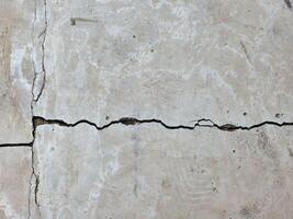 Long cracks in the cement surface photo