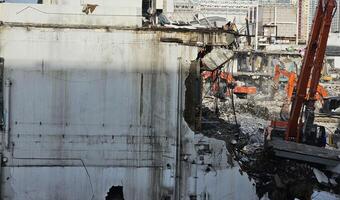 Construction site, excavator equipped building demolition office or large shopping mall photo