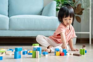 Happy Asia children play and learn toy blocks.family is happy and excited in the house. daughter having fun spending time, Activity, development, IQ, EQ, meditation, brain, muscles, essential skills. photo