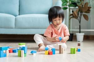 Happy Asia children play and learn toy blocks.family is happy and excited in the house. daughter having fun spending time, Activity, development, IQ, EQ, meditation, brain, muscles, essential skills. photo