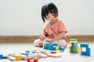 Happy Asia children play and learn toy blocks.family is happy and excited in the house. daughter having fun spending time, Activity, development, IQ, EQ, meditation, brain, muscles, essential skills. photo
