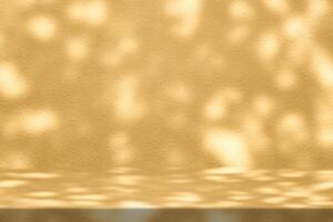 Gold Stucco Table with Bokeh and Nature Shadow on Concrete Wall Texture Background photo