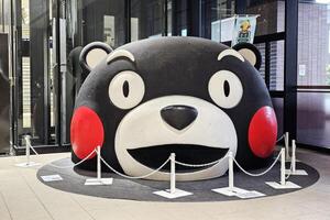 Kumamoto, Japan November 17, 2023 Huge Kumamon head at Kumamoto station. It is a famous mascot character in Japan. photo