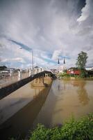 River View with ancient church, the Baptist tower over the city skyline and Reflective Waters. photo