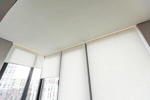 Fragment of a stretch ceiling with the hidden LED illumination photo