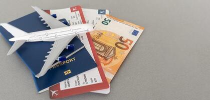 Top view of traveler accessories, passports and air tickets on background with copy space for text. Travel vacation concept photo