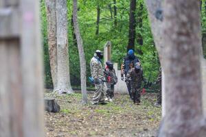kids team play paintball on the field photo