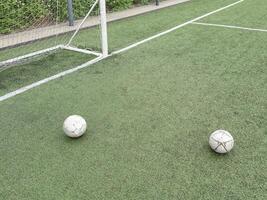 old football on Artificial turf football field green photo