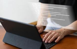Online documentation database and document management system concept. Businesswoman working on laptop with virtual screen. Process automation to efficiently manage files photo
