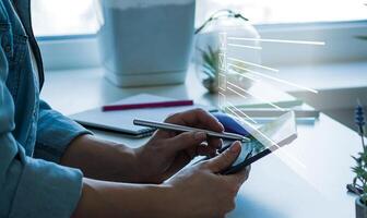 Paperless workplace idea, e-signing, electronic signature, document management. A businessman signs an electronic document on a digital document on a virtual notebook screen using a stylus pen photo