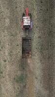 Top View Of Tractor Fertilizing Farm Field. video